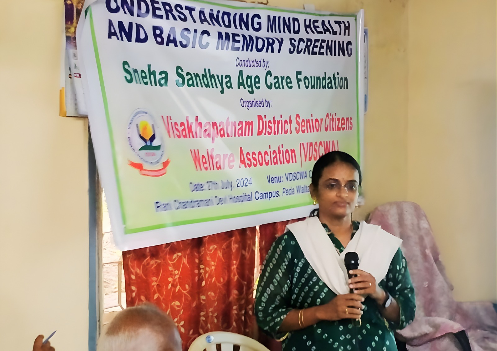 Caregiver assisting a senior woman with a puzzle.